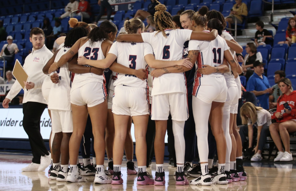 FAU Women’s Basketball team huddled up during a timeout in their home opener vs. Mercer